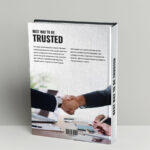 A book cover with two people shaking hands.